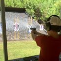 Gun saftey training a young boy